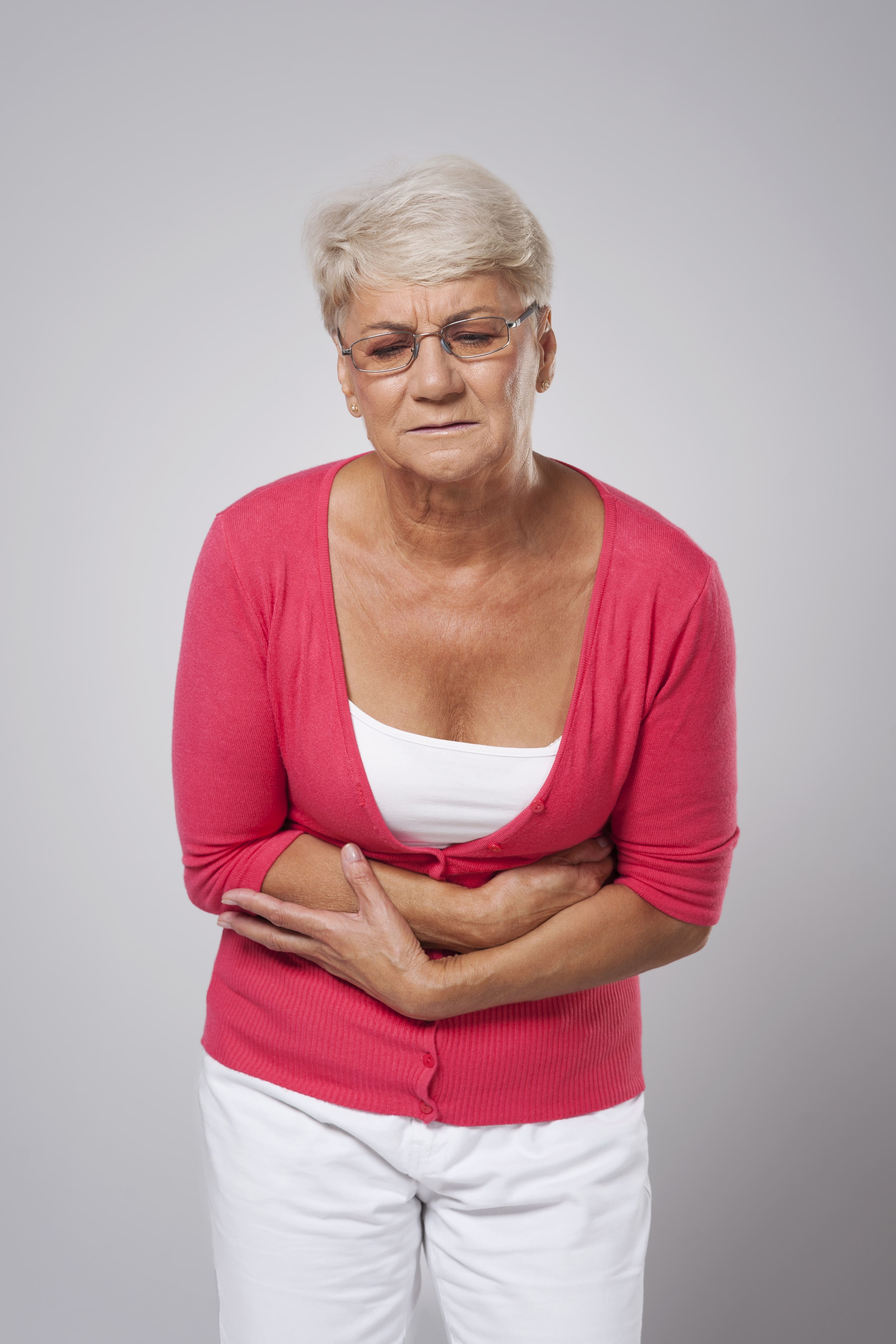 old woman experiencing endometriosis pain during menopause